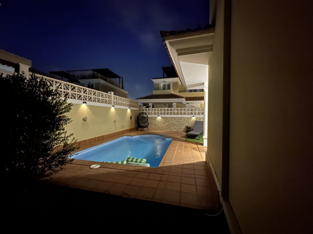 Villa Solymar roof terrace by night — pool and balcony lit up